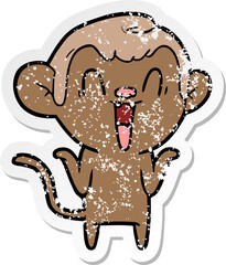 distressed sticker of a cartoon laughing monkey