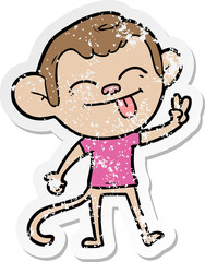 distressed sticker of a funny cartoon monkey making peace sign
