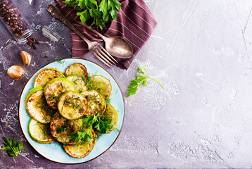 Sliced spiced zucchini with oil, salt and garlic