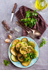 Sliced spiced zucchini with oil, salt and garlic