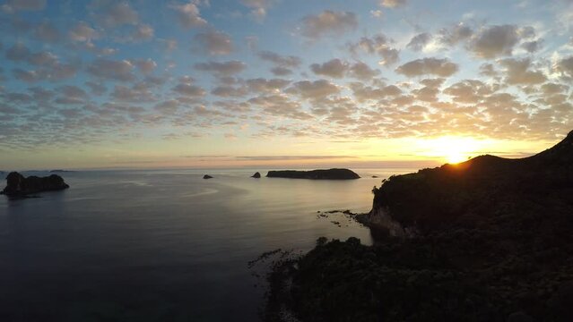 Aerial view of romantic sunrise over the ocean and islands