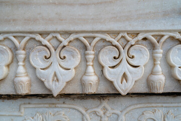 TajMahal architecture floral pattern detail on marble wall Agra India