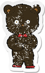 retro distressed sticker of a cartoon cute little bear
