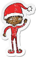 retro distressed sticker of a cartoon waving christmas elf