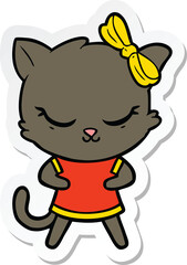 sticker of a cute cartoon cat with bow