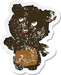 retro distressed sticker of a cartoon happy little teddy black bear