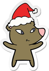 cute hand drawn sticker cartoon of a bear wearing santa hat