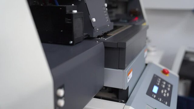 Plotter printing. Printing services and printing. The plotter prints the image.