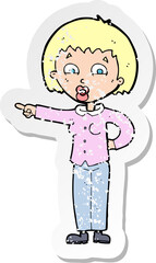 retro distressed sticker of a cartoon pointing woman