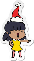 hand drawn sticker cartoon of a happy girl wearing santa hat