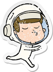 Obraz premium distressed sticker of a cartoon confident astronaut