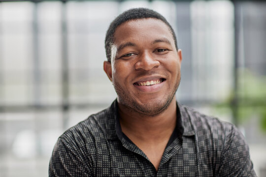 african american man in blurred office closeup