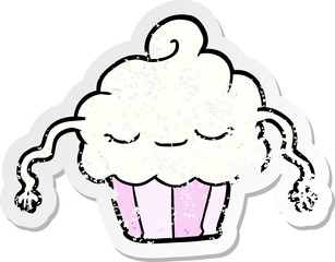 distressed sticker of a cartoon cupcake