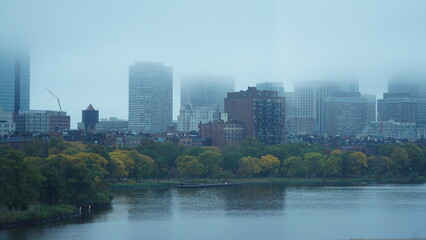 The city view with the old buildings and street in the rainy day
