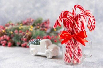 Christmas candy.Candy cane.Christmas composition with gifts, Christmas tree decorations on a blue background. Concept for Christmas and New Year holidays. Winter. Flatlay, top view, copy space.