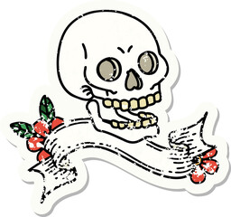 worn old sticker with banner of a skull