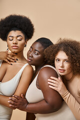confident and charming plus size women in underwear on beige backdrop, natural body positive beauty