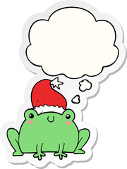 cute cartoon christmas frog with thought bubble as a printed sticker