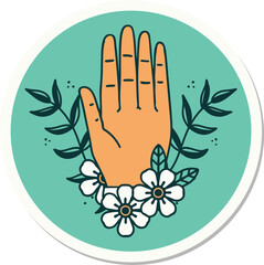 sticker of tattoo in traditional style of a hand and flower