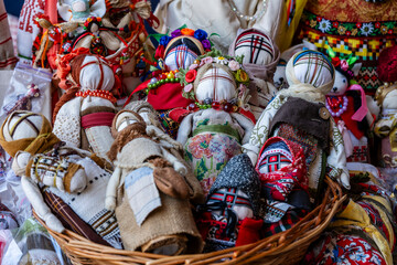 Close-up of a traditional amulet doll for sale to tourists at a street market, Kyiv, Ukraine. Ukrainian motanka dolls