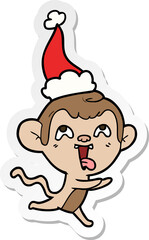 crazy hand drawn sticker cartoon of a monkey running wearing santa hat