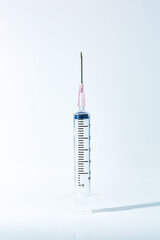 Macro syringe,A 5ml syringe and needle isolated on a white background with detailed clipping path,Close up of a syringe. Focus on numbers