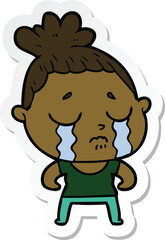 sticker of a cartoon tough woman crying