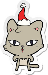 hand drawn sticker cartoon of a cat wearing santa hat