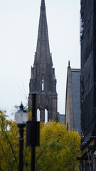 The city view with the old buildings and street in the rainy day