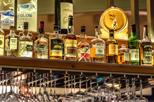 Heraklion, CreteGreece-10.20.2023:Bar Shelves Showcasing Well-Known Rom and Whisky Alcohol Brands. Selection creates a vibrant display, inviting patrons to explore a world of premium spirits.