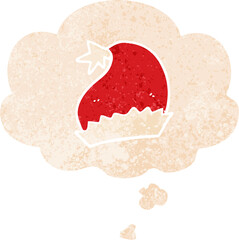 cartoon santa hat with thought bubble in grunge distressed retro textured style