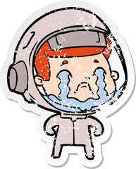 distressed sticker of a cartoon crying astronaut