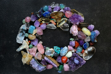 colorful crystal gemstones close up on abstract dark background. Minerals set for esoteric...