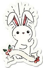 worn old sticker of a tattoo style cute bunny