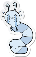 sticker of a cartoon crying caterpillar