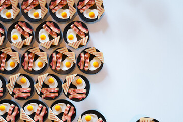 Artistic Overhead View of a Symmetrical Breakfast Pattern with Eggs and Bacon