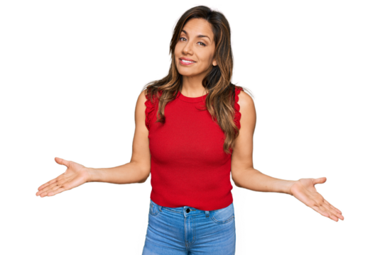 Young hispanic woman wearing casual clothes clueless and confused expression with arms and hands raised. doubt concept.