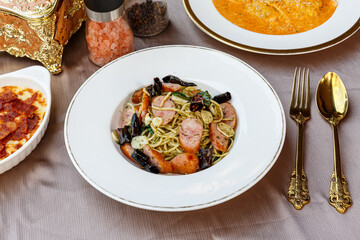 Spaghetti with spicy mixed sausage. Fusion Food.