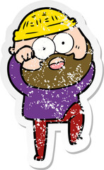 distressed sticker of a cartoon surprised bearded man