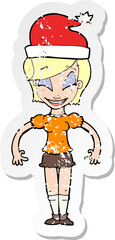 retro distressed sticker of a cartoon woman ready for christmas