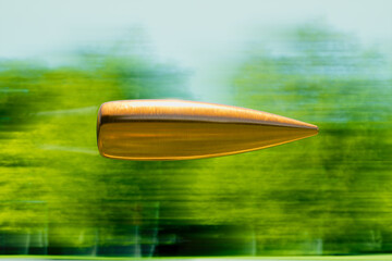 Enigmatic Copper Object Levitating Against a Dynamic Green Blur