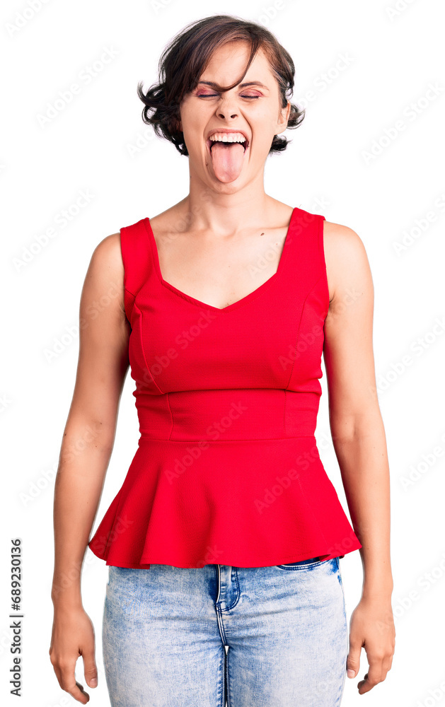 Poster beautiful young woman with short hair wearing casual style with sleeveless shirt sticking tongue out