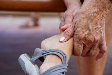 A woman touching at pain point with arthritis and tendon problems