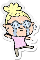 distressed sticker of a cartoon crying woman wearing spectacles