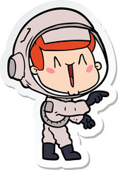 Fototapeta premium sticker of a happy cartoon astronaut pointing