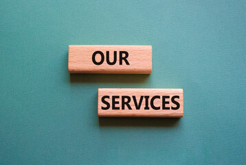 Our services symbol. Concept words Our services on wooden blocks. Beautiful grey green background. Business and Our services concept. Copy space.