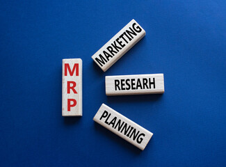 MRP - Marketing Research Planning symbol. Concept word MRP on wooden cubes. Beautiful deep blue background. Business and MRP concept. Copy space.