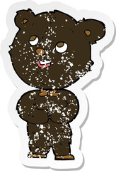 retro distressed sticker of a cartoon cute teddy bear