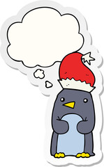 cute christmas penguin with thought bubble as a printed sticker