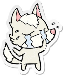 distressed sticker of a cartoon crying wolf